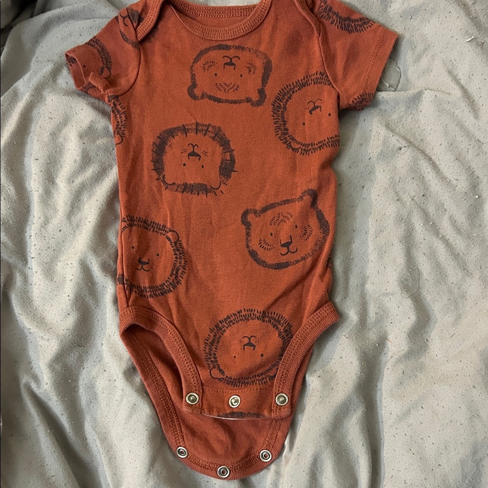 Lion Print Rust Baby Onesie